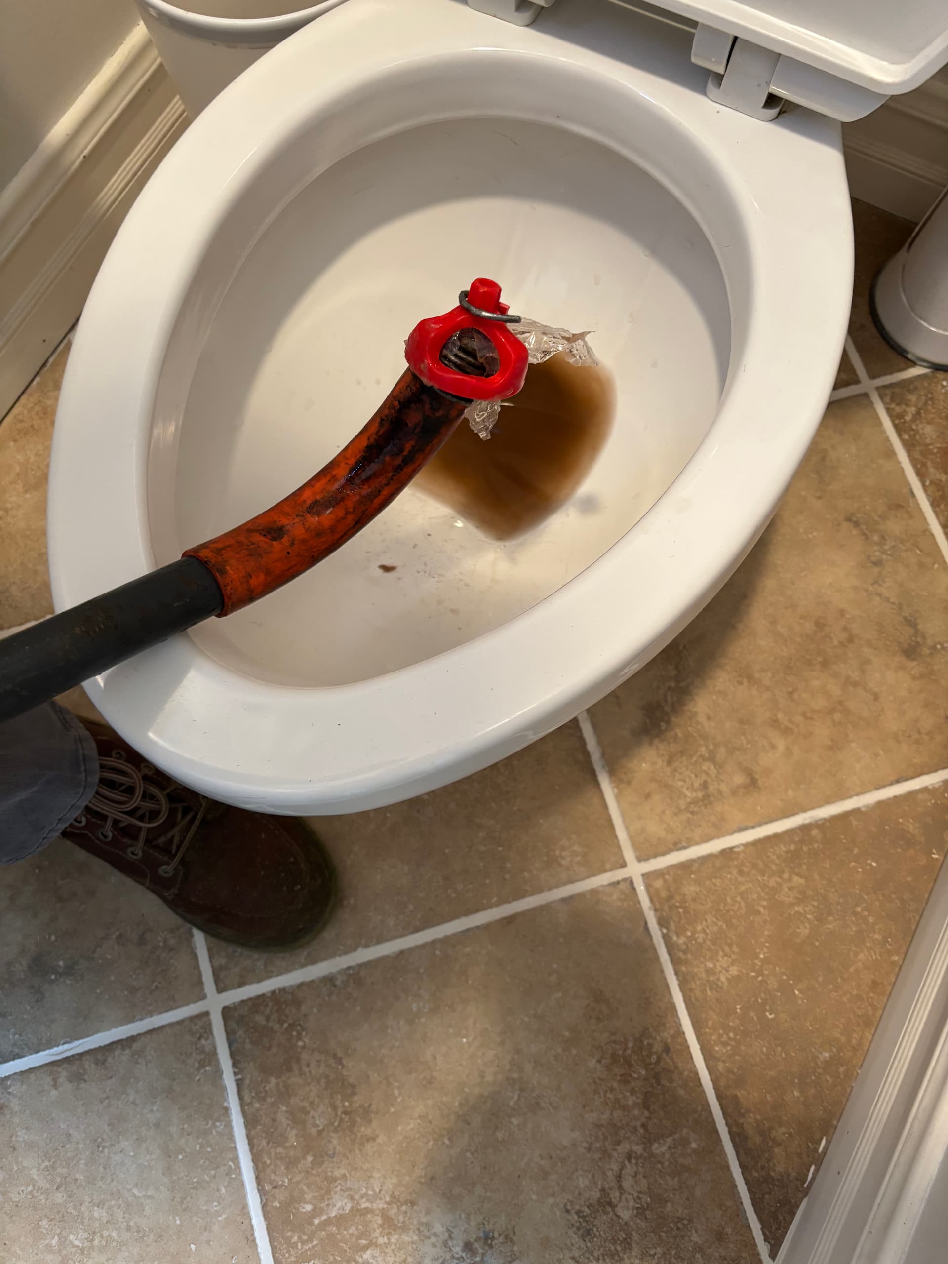 Addressing Stubborn Toilet Clogs with Expertise image