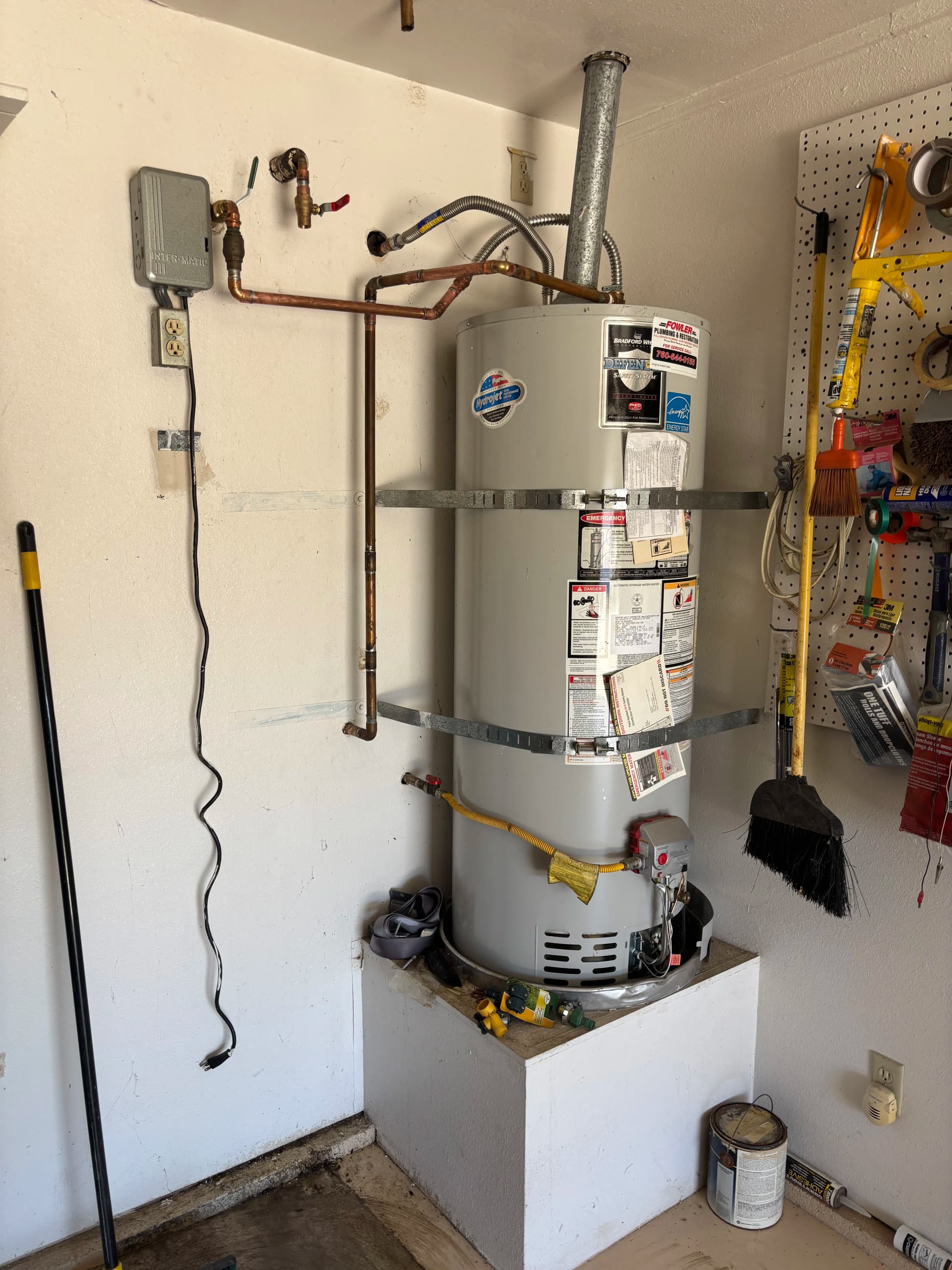 Gallery photos for Removing an Outdated Solar Water Heater Setup From a Garage: Image #1